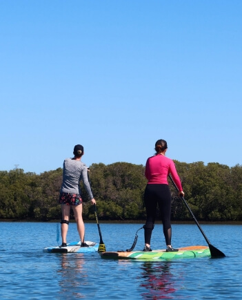 Paddle boarding on Lake Cormoranche